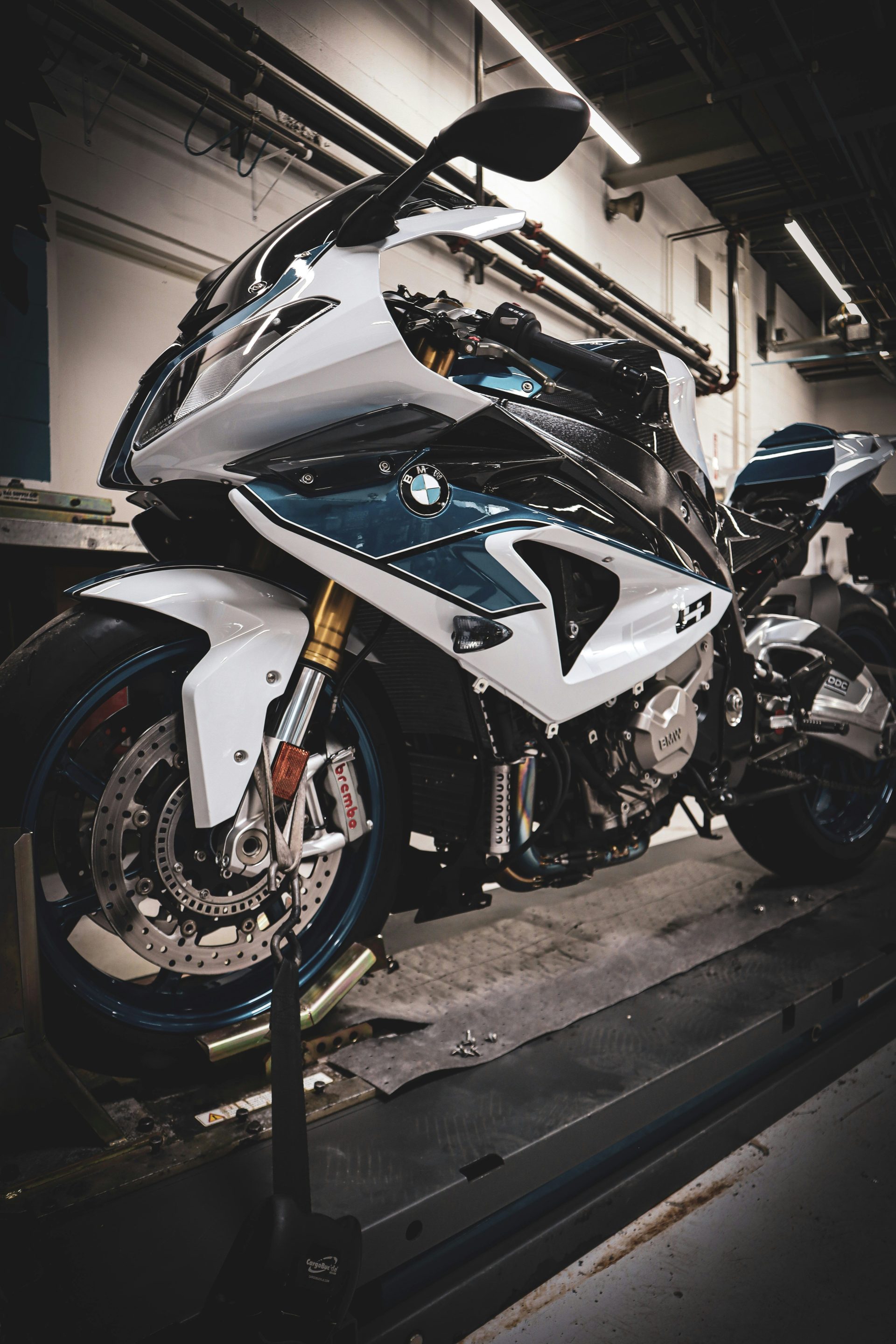 A sleek white and blue BMW motorcycle.